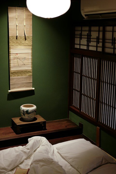 A traditional japanese room with tatami mats and shoji screens