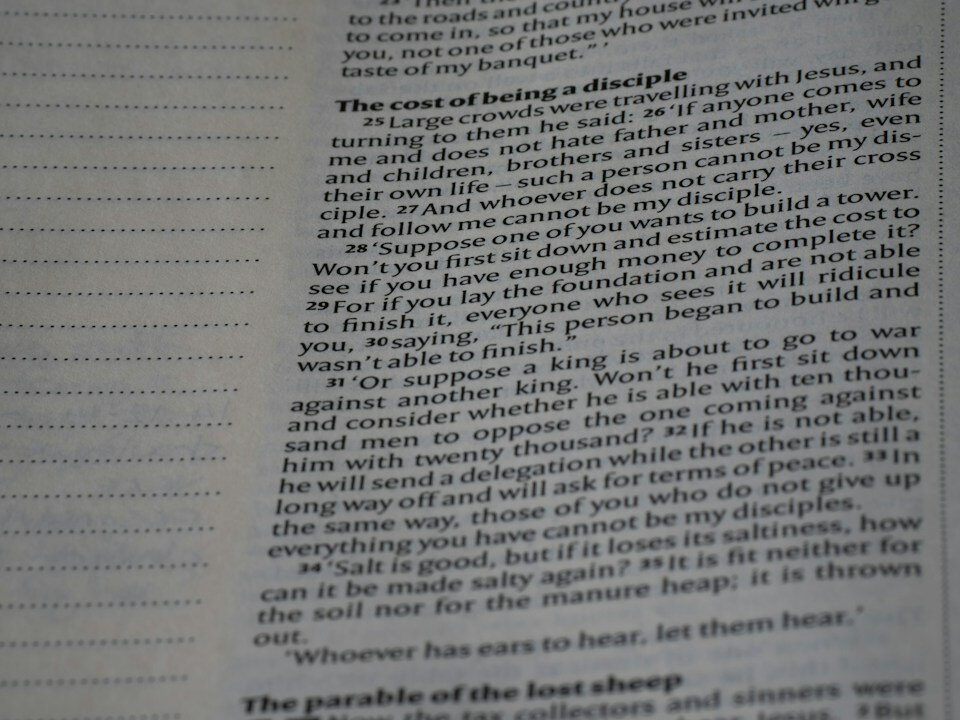 A close up of an open book with text