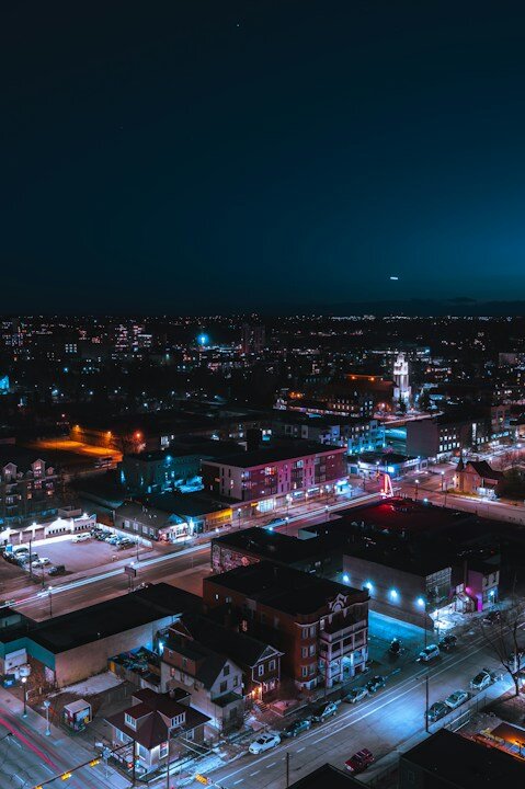 city with high rise buildings during night time