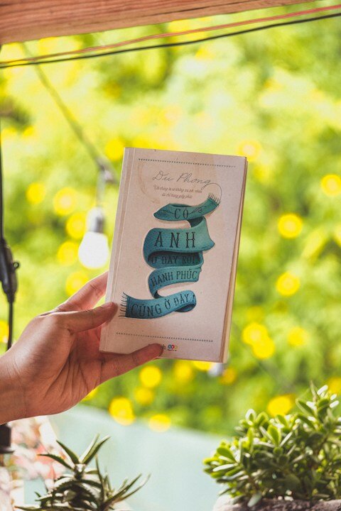 a person holding a book in their hand